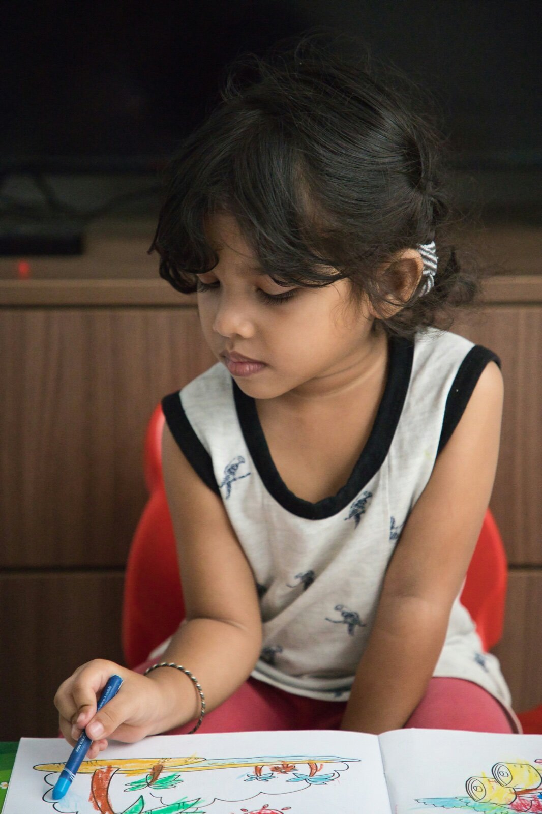 Child focused on coloring an art project