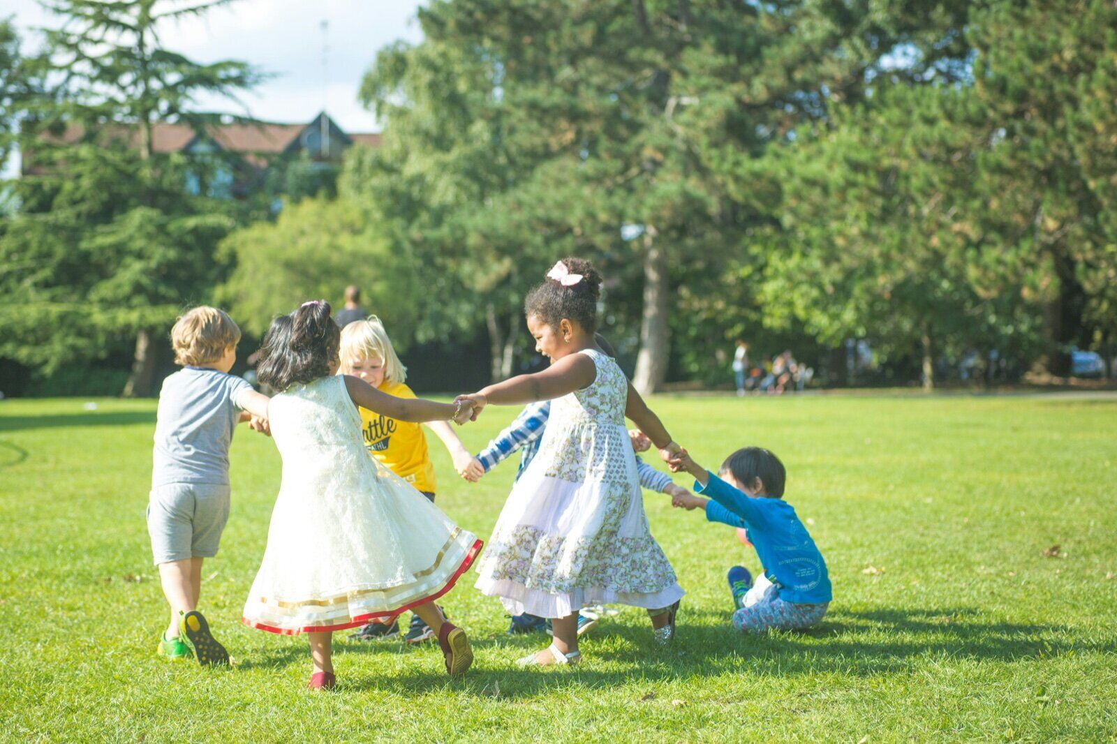 Group of kids playing together at an outdoor park