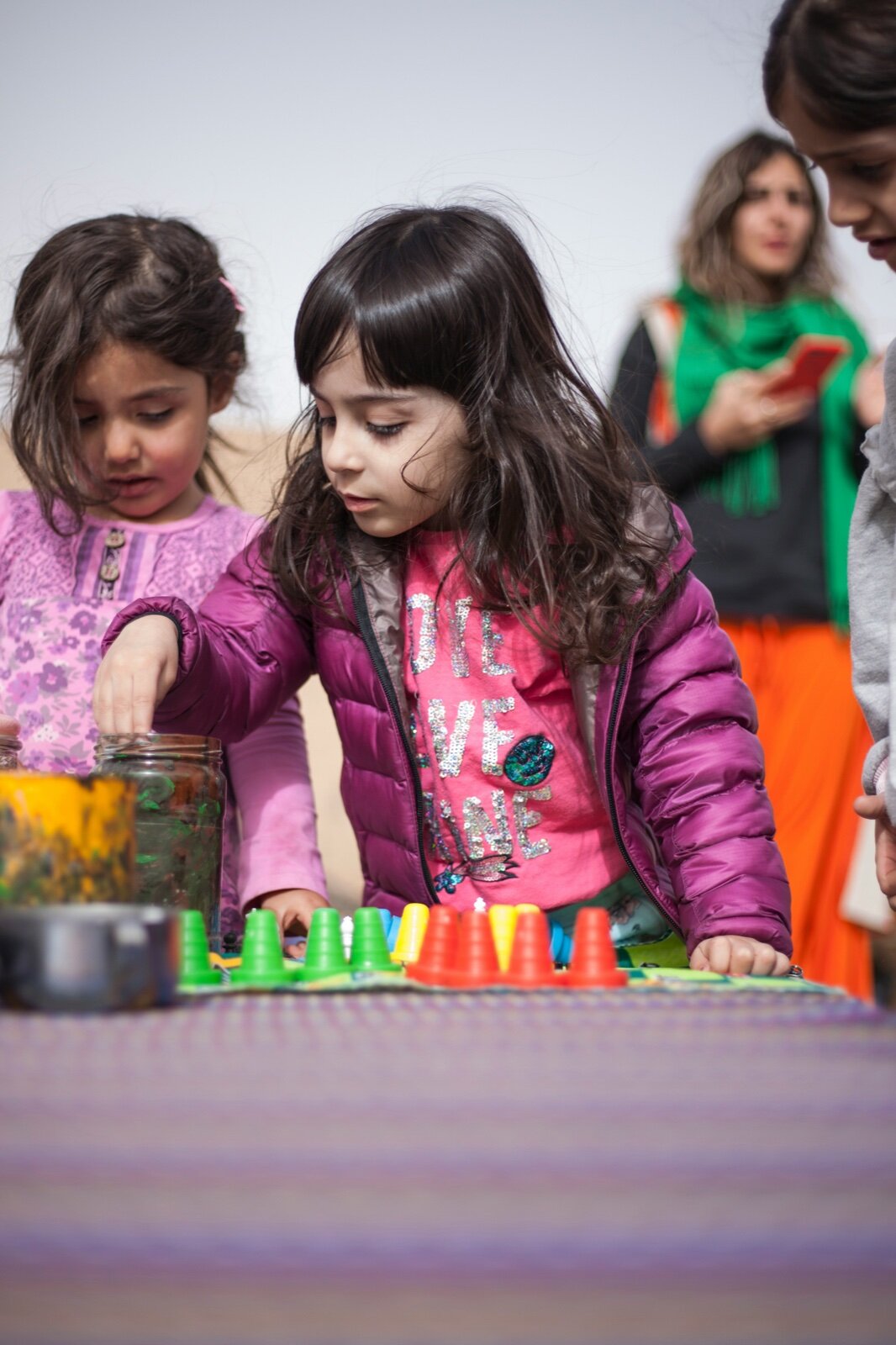 Child engaged in a STEM counting activity with manipulatives